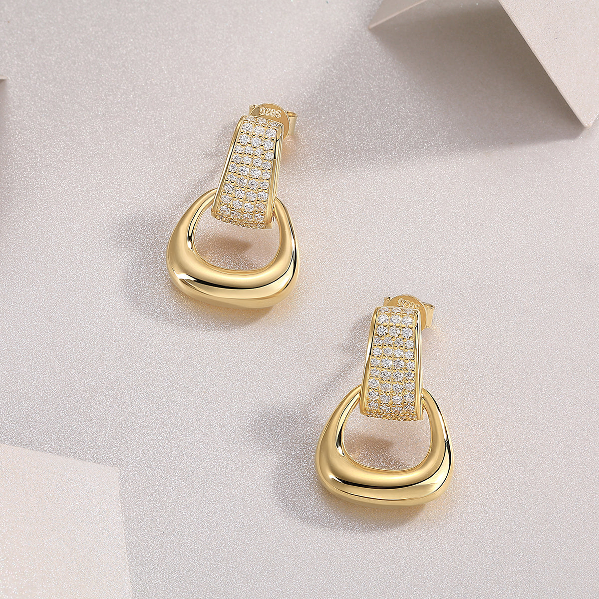 All-encompassing luxury stud earrings